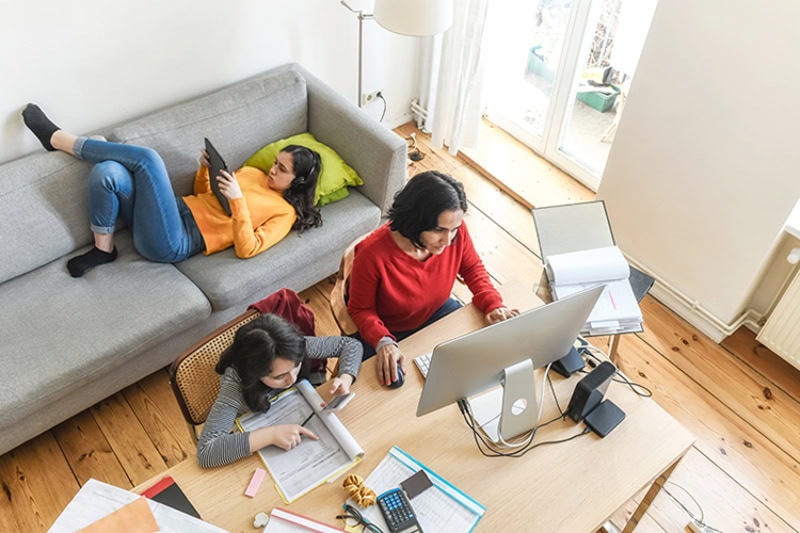An overhead shot of 2 people in a living room.