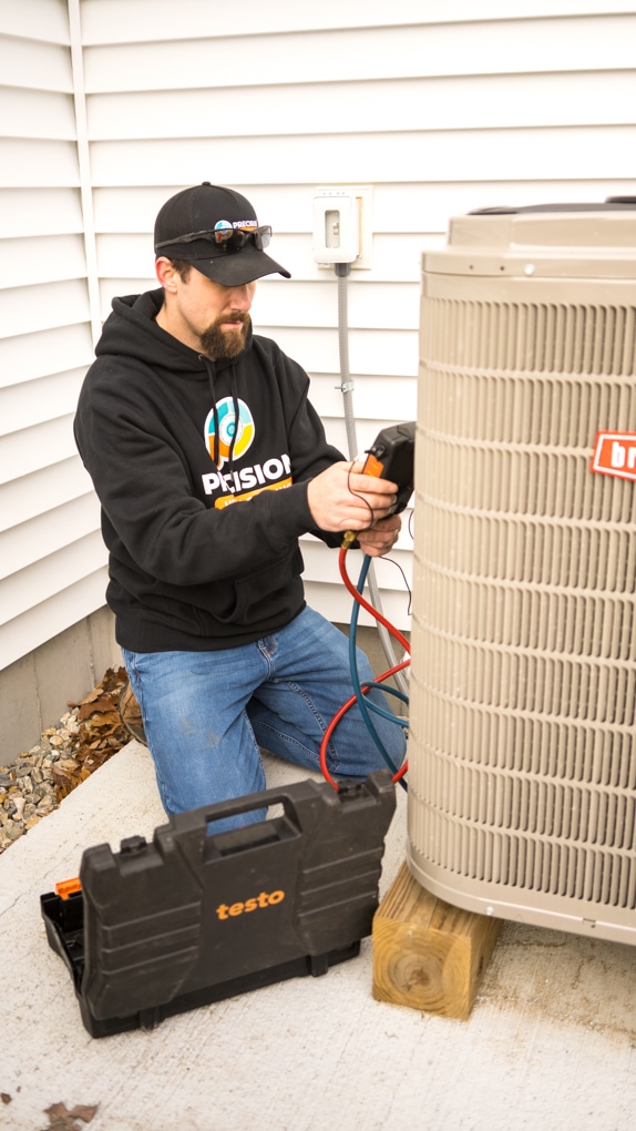 Precision Technician working on Air Conditioning Unit